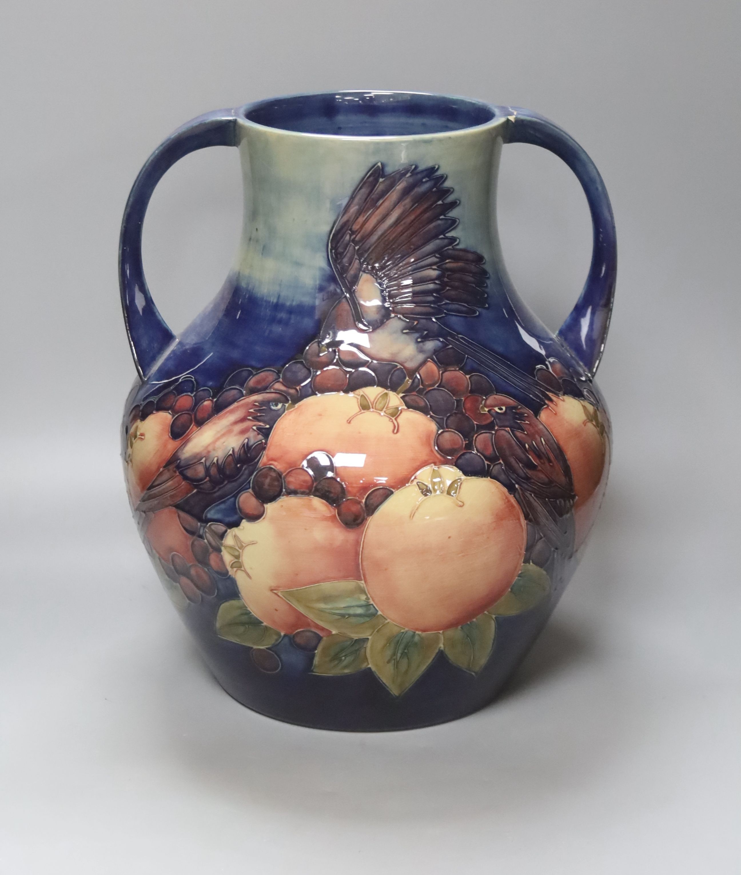 A large Moorcroft finches and fruit two handled vase, height 36cm